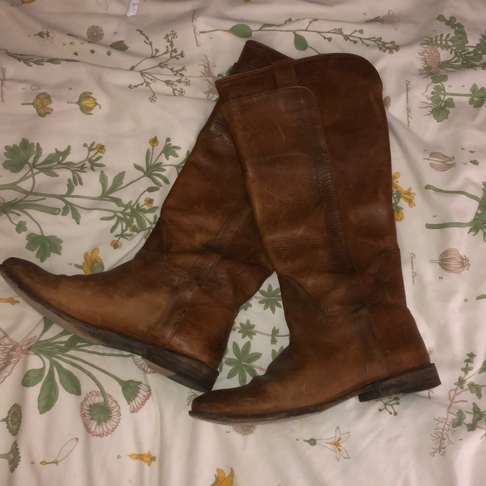 Tall Frye leather boots.